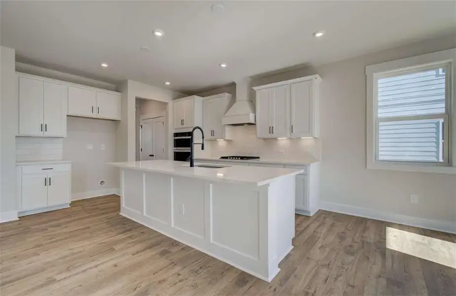 Furnished interior view inside a new home in The Paddocks at Doc Hughes, Buford (Image 5).