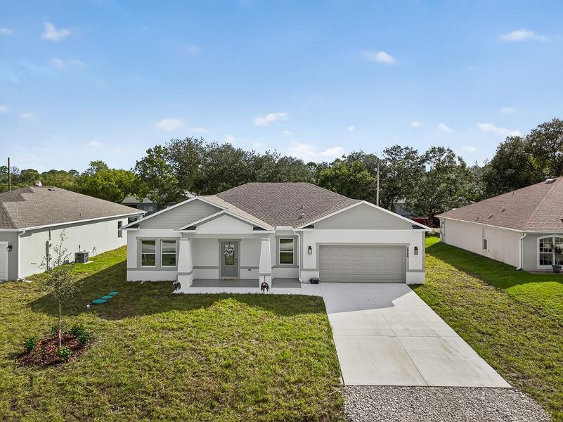 Front exterior of a new home in , Vero Beach, FL, highlighting curb appeal (Image 1). Front exterior of a new home in , Vero Beach, FL, highlighting curb appeal (Image 1).
