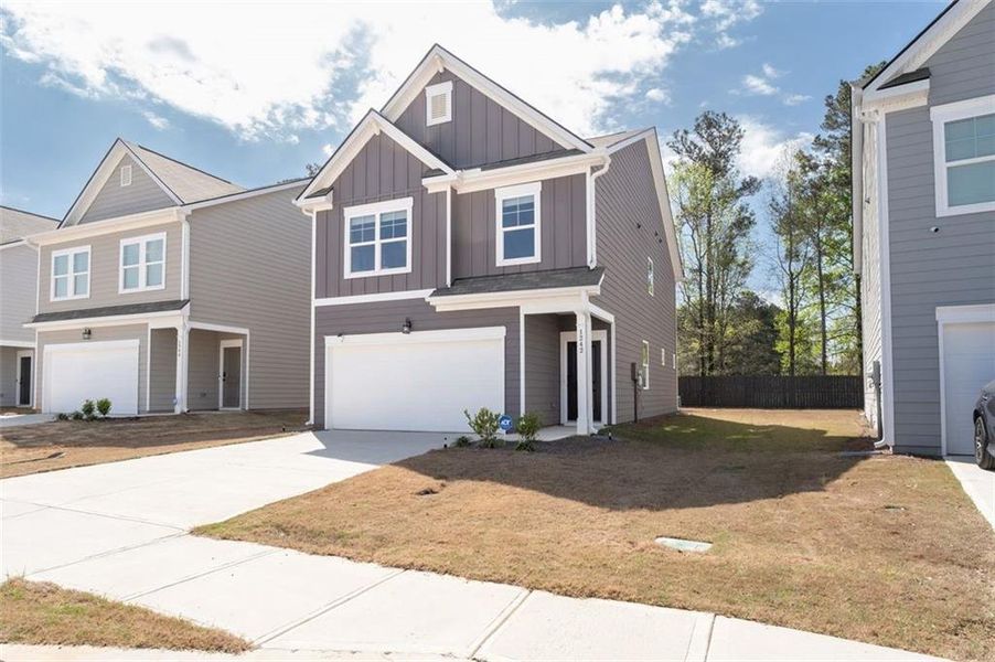 Front exterior of a new home in Walden Park - The Retreat, Jonesboro, GA, highlighting curb appeal (Image 24).