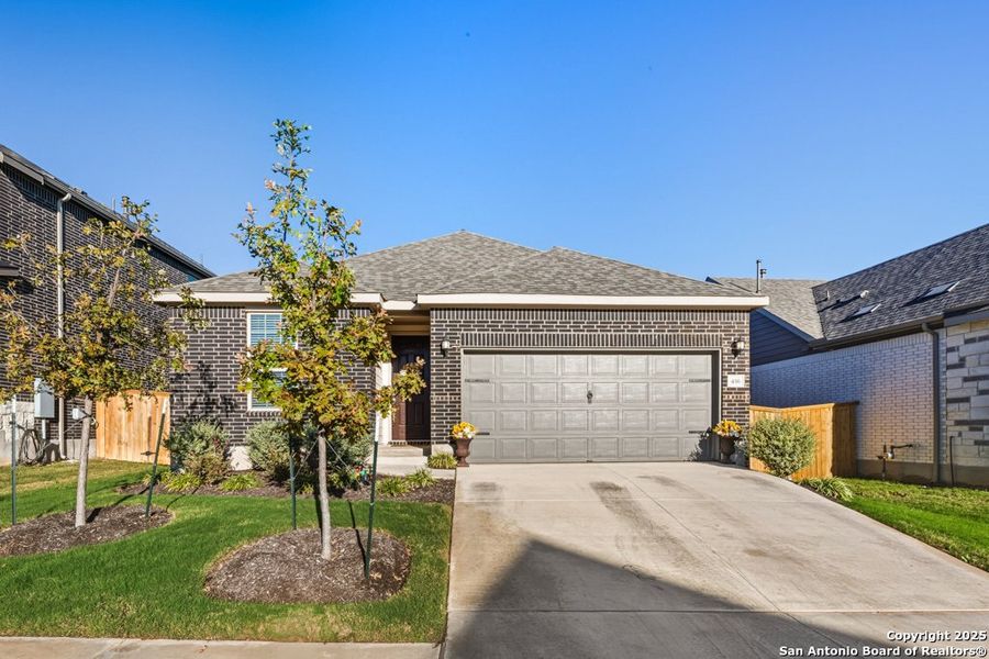 Front exterior of a new home in La Cima, San Marcos, TX, highlighting curb appeal (Image 21). Front exterior of a new home in La Cima, San Marcos, TX, highlighting curb appeal (Image 21).