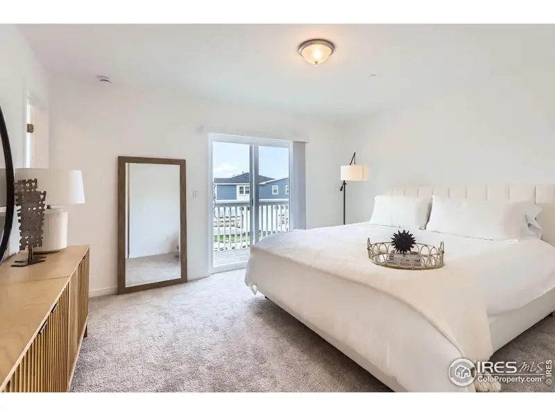 Primary with walk out balcony.