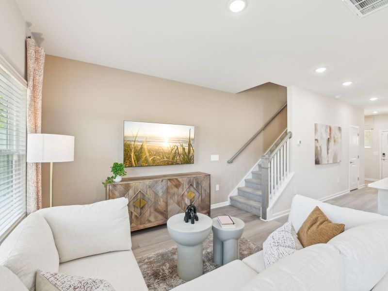 Great room in the Topaz floorplan at a Meritage Homes community in Mebane, NC.