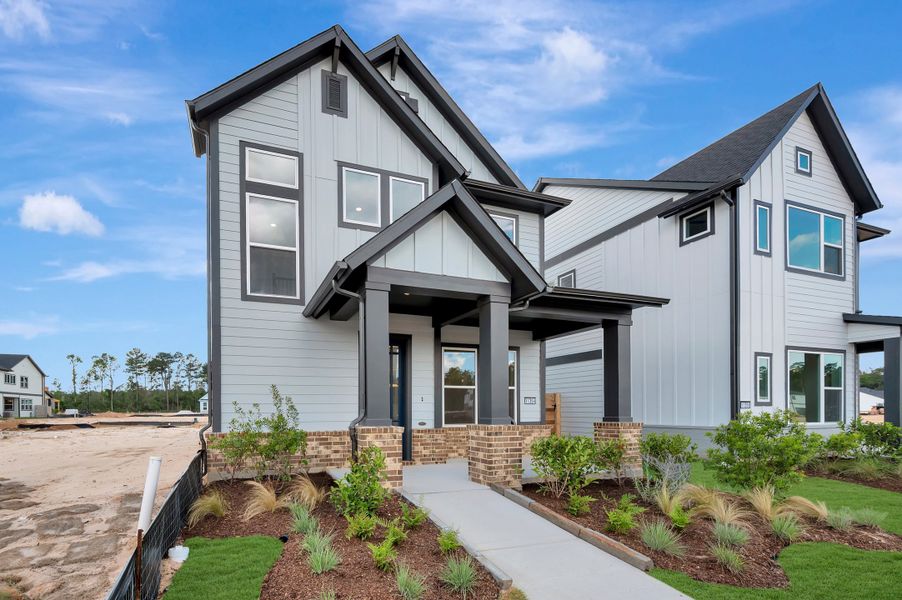 Front exterior of a new home in Two Step Farm - Cottages Row Collection, Montgomery, TX, highlighting curb appeal (Image 22).