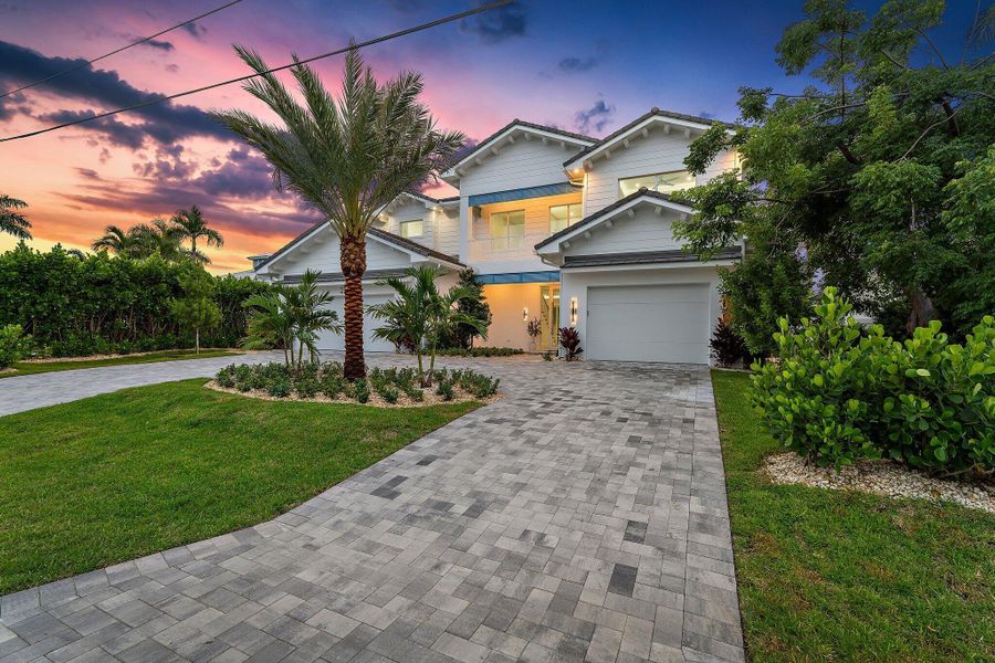 Front exterior of a new home in , Tequesta, FL, highlighting curb appeal (Image 35). Front exterior of a new home in , Tequesta, FL, highlighting curb appeal (Image 35).