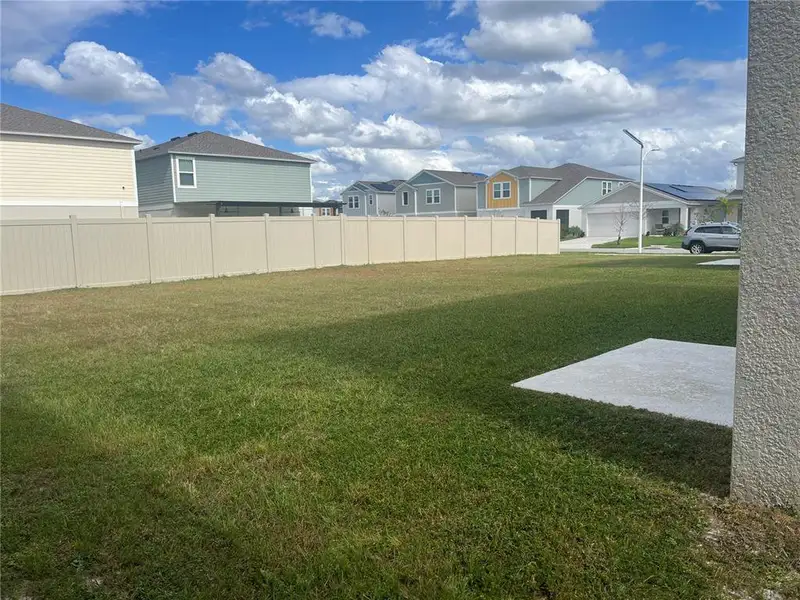 Exterior details and patio area of a home in Pasadena Point, Wesley Chapel (Image 2).
