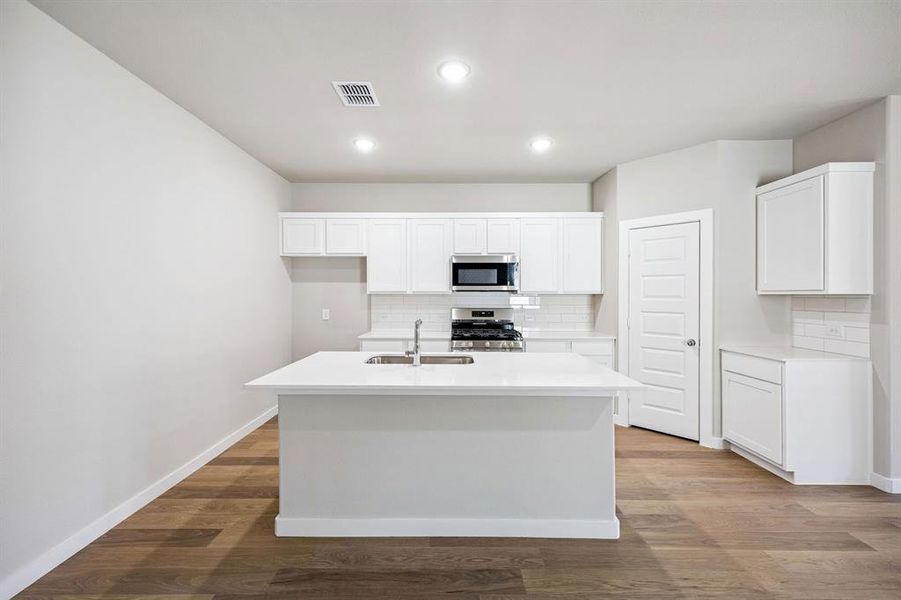 Kitchen in the Willow home plan by Trophy Signature Homes – REPRESENTATIVE PHOTO
