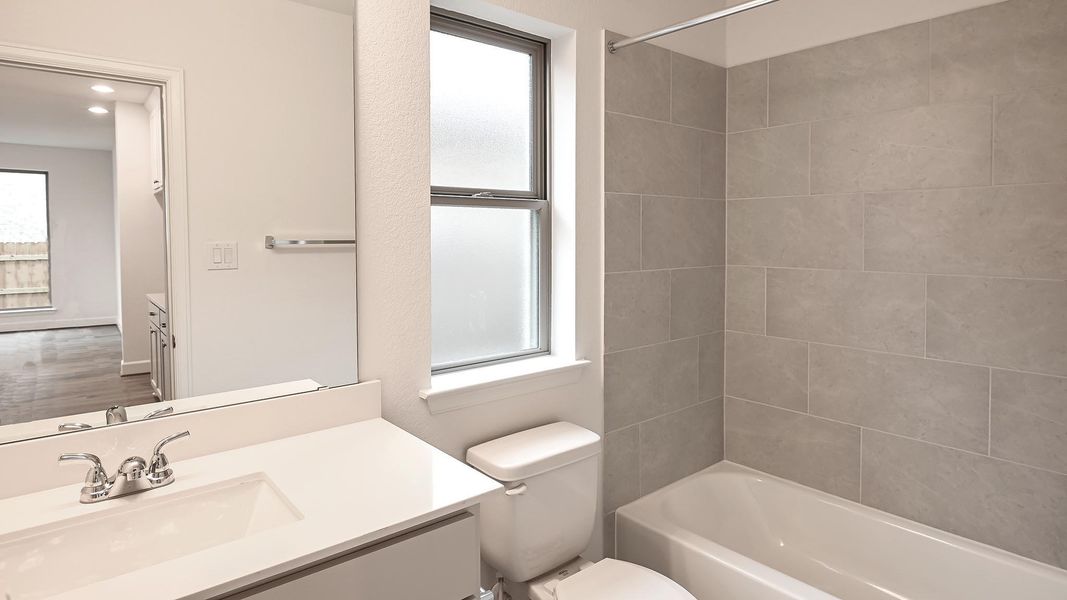 Furnished interior view inside a new home in Crosswinds, Kyle (Image 12).