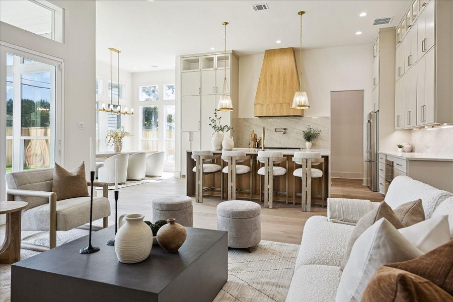 The open layout makes everyday living feel easy and entertaining feel effortless, with the kitchen, dining and family rooms all flowing together in one inviting space. Soaring 12-foot ceilings, wide plank engineered white oak flooring and Visual Comfort lighting add warmth, scale and a polished custom feel throughout.