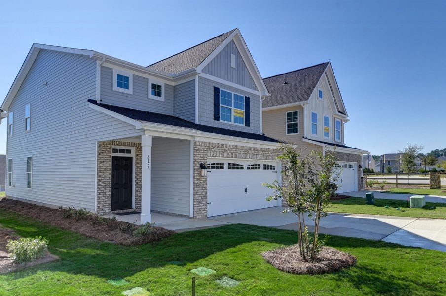 Front exterior of a new home in Ashton Lakes, Lexington, SC, highlighting curb appeal (Image 2).