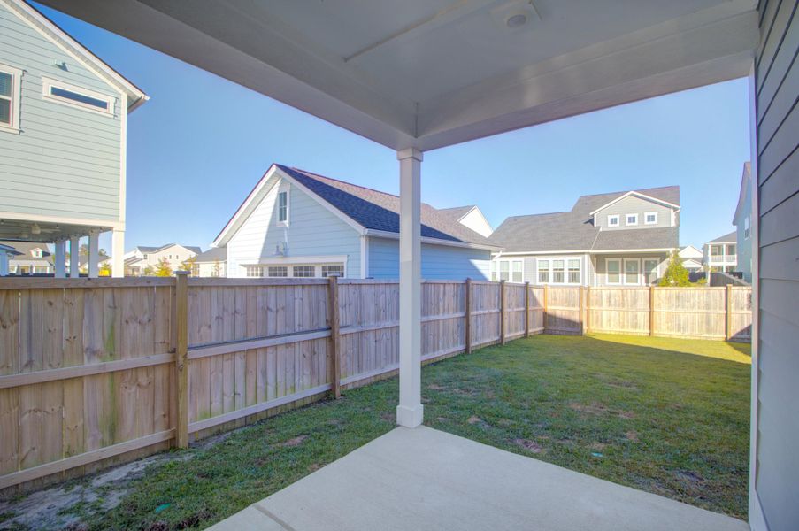 Exterior details and patio area of a home in Carnes Crossroads: Row Collection, Summerville (Image 2). Exterior details and patio area of a home in Carnes Crossroads: Row Collection, Summerville (Image 2).