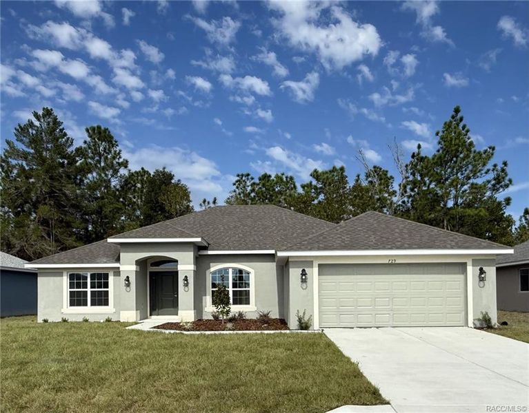Front exterior of a new home in The Pines at Citrus Springs, Citrus Springs, FL, highlighting curb appeal (Image 1).
