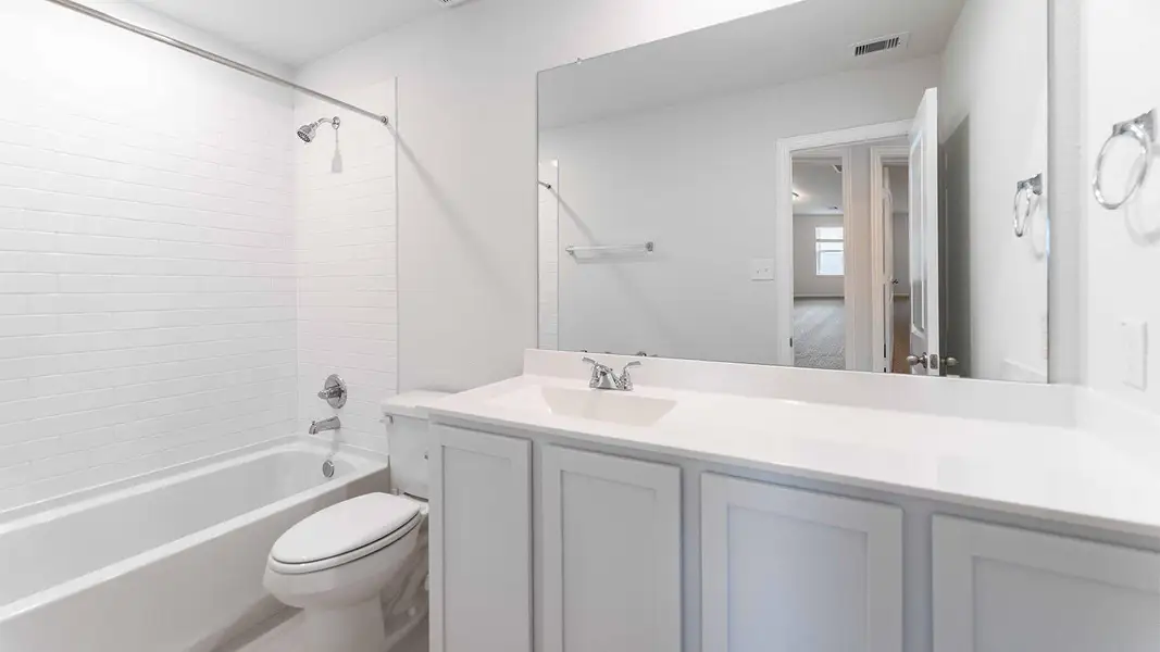 Furnished interior view inside a new home in Bluestem, Brookshire (Image 2). Furnished interior view inside a new home in Bluestem, Brookshire (Image 2).