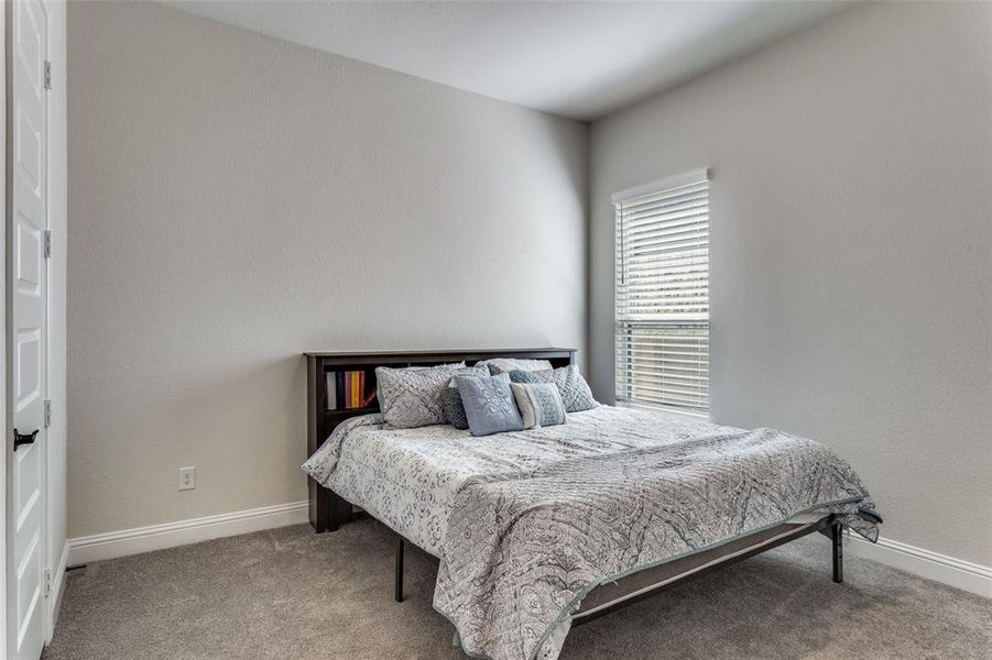 Bedroom with carpet and baseboards Bedroom with carpet and baseboards