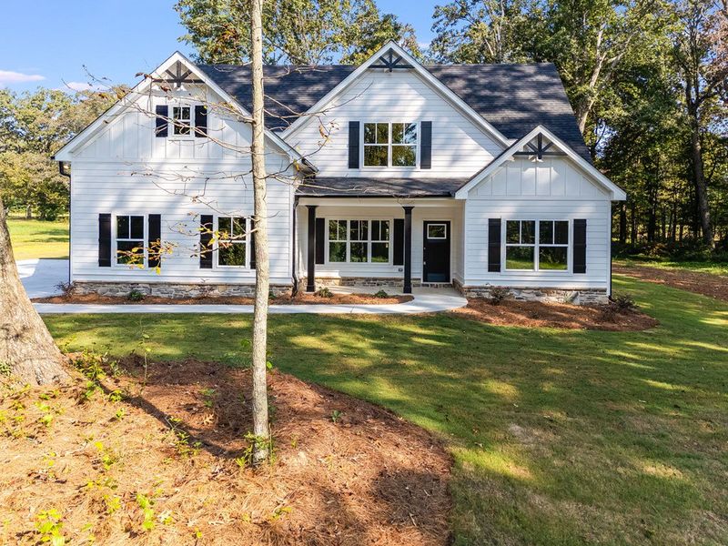 Front exterior of a new home in LOVVORN ESTATES, Carrollton, GA, highlighting curb appeal (Image 24).