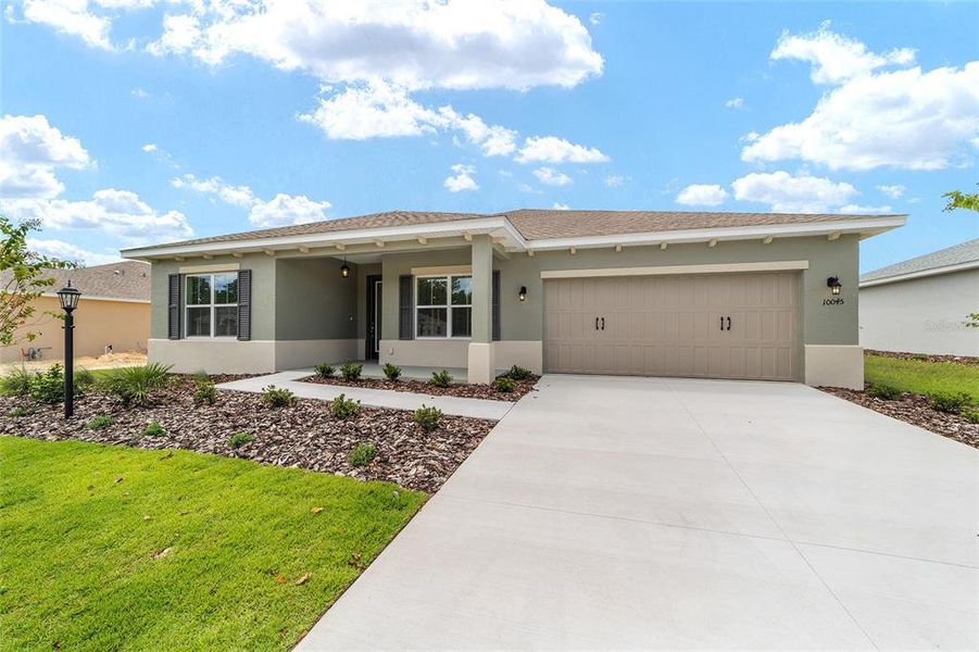 Front exterior of a new home in On Top of the World Communities, Ocala, FL, highlighting curb appeal (Image 2).