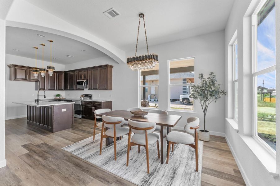 Defined formal dining area just off the kitchen, sized for a large table. Defined formal dining area just off the kitchen, sized for a large table.