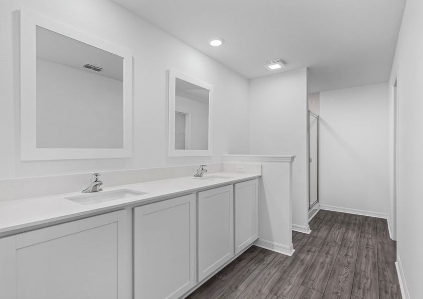 The master bathroom has a spacious double-sink vanity