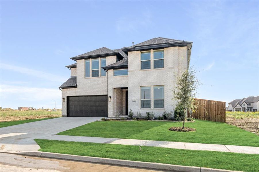 Front exterior of a new home in Wildflower Ranch 60-65, Fort Worth, TX, highlighting curb appeal (Image 25). Front exterior of a new home in Wildflower Ranch 60-65, Fort Worth, TX, highlighting curb appeal (Image 25).