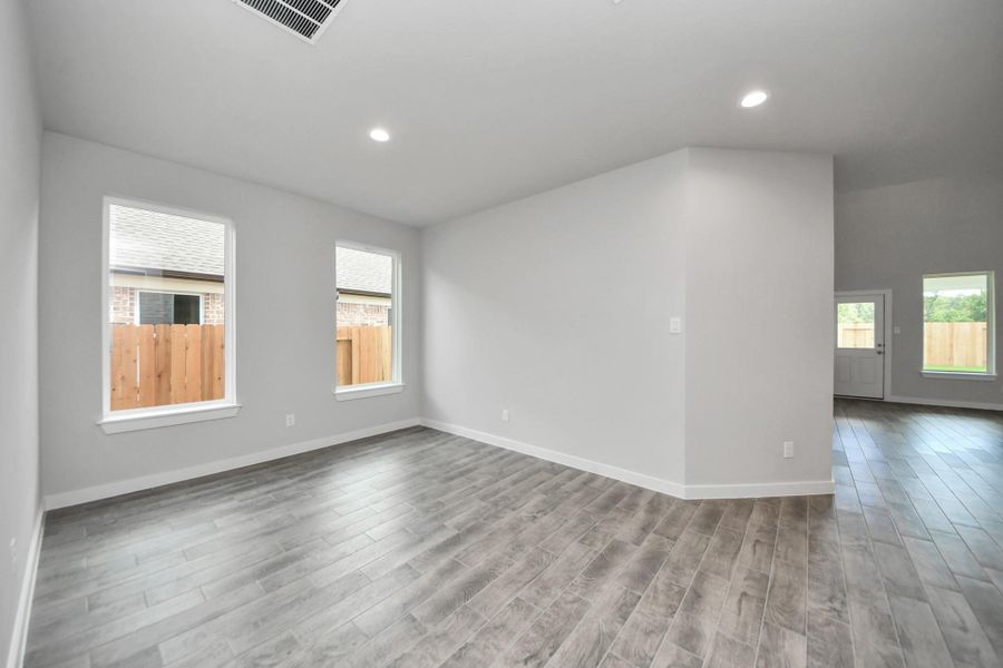 Create lasting memories with your family and friends at the dining table! This expansive dining room showcases sophisticated flooring, custom paint, and seamlessly connects to the family room and kitchen, providing an open and inviting atmosphere! Create lasting memories with your family and friends at the dining table! This expansive dining room showcases sophisticated flooring, custom paint, and seamlessly connects to the family room and kitchen, providing an open and inviting atmosphere!