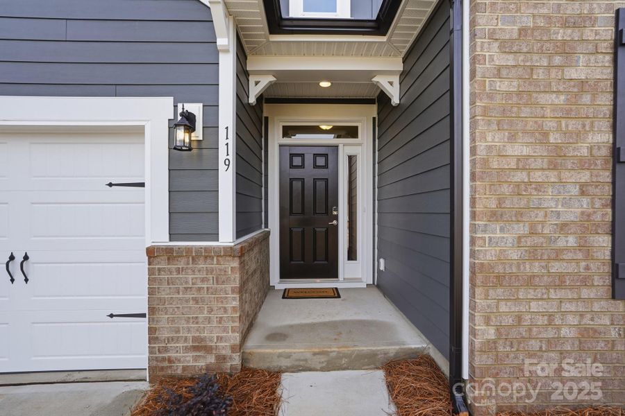 Exterior details and patio area of a home in Villas at Prestwick, Mooresville (Image 22).