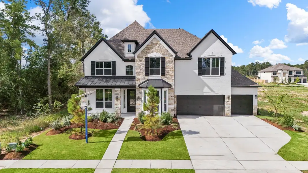Front exterior of a new home in ARTAVIA, Conroe, TX, highlighting curb appeal (Image 2). Front exterior of a new home in ARTAVIA, Conroe, TX, highlighting curb appeal (Image 2).
