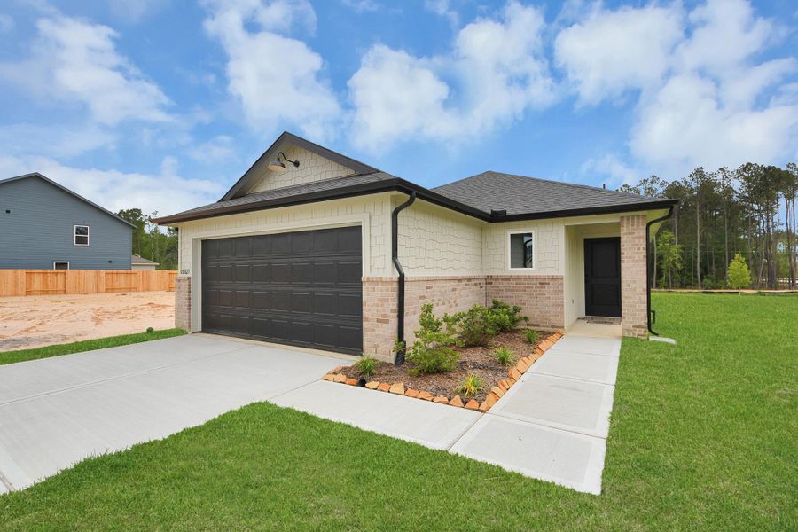 Front exterior of a new home in The Enclave at Spring Branch, Conroe, TX, highlighting curb appeal (Image 21). Front exterior of a new home in The Enclave at Spring Branch, Conroe, TX, highlighting curb appeal (Image 21).