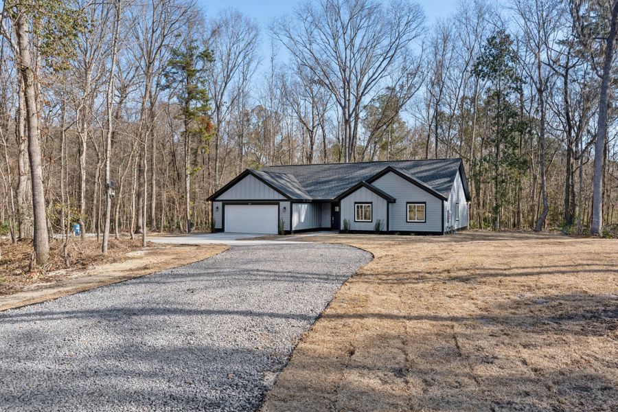 Front exterior of a new home in , Moncks Corner, SC, highlighting curb appeal (Image 25). Front exterior of a new home in , Moncks Corner, SC, highlighting curb appeal (Image 25).