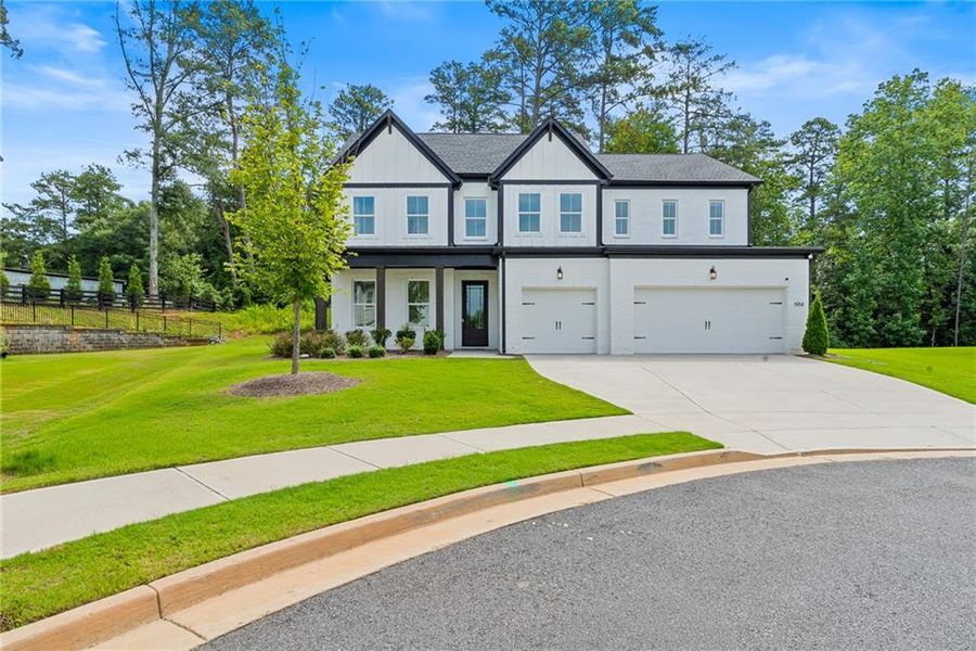 Front exterior of a new home in , Marietta, GA, highlighting curb appeal (Image 24).