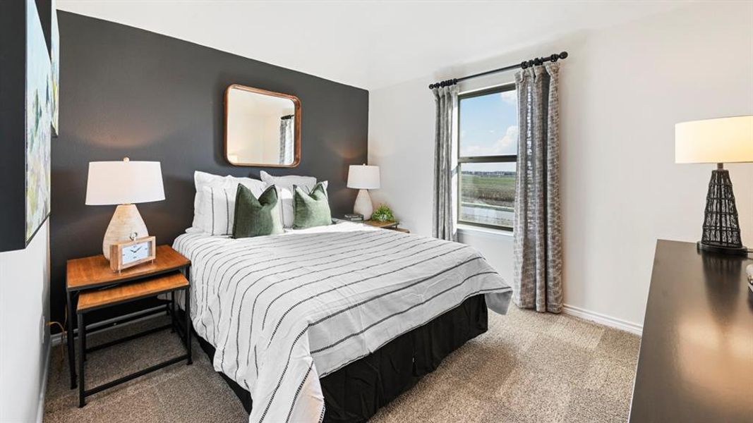 Carpeted bedroom with baseboards