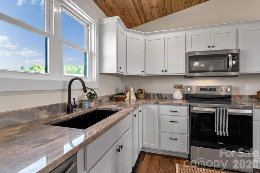 Kitchen w/granite tops and SS appliances