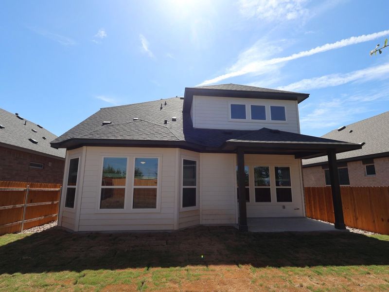 Exterior details and patio area of a home in Heritage, Dripping Springs (Image 3).