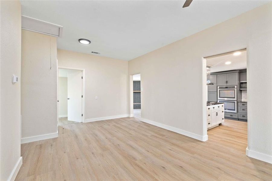Unfurnished room with light wood finished floors, recessed lighting, and ceiling fan Unfurnished room with light wood finished floors, recessed lighting, and ceiling fan