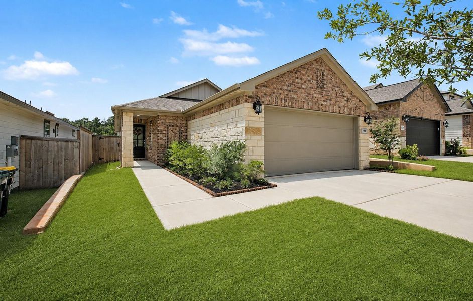 Front exterior of a new home in Montgomery Oaks - Premier, Conroe, TX, highlighting curb appeal (Image 24). Front exterior of a new home in Montgomery Oaks - Premier, Conroe, TX, highlighting curb appeal (Image 24).