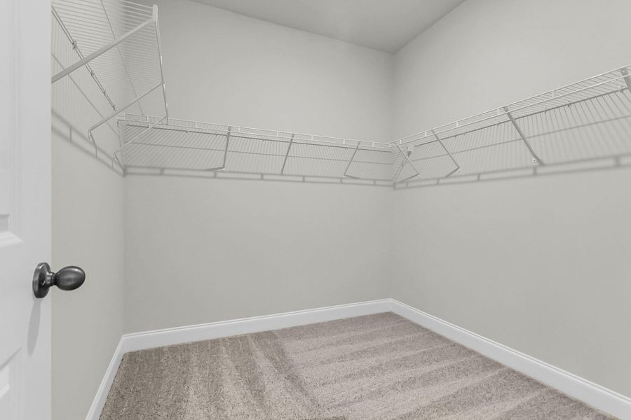 Spacious, unfurnished interior of a new home in Tidewater at Lakes of Cane Bay, Summerville (Image 31).