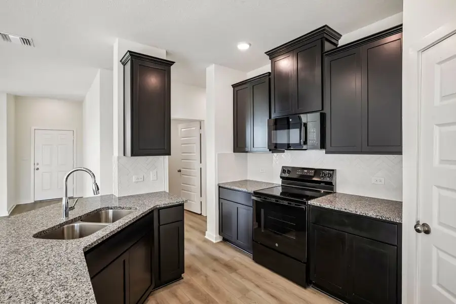 Furnished interior view inside a new home in Rancho San Gabriel, Georgetown (Image 3).