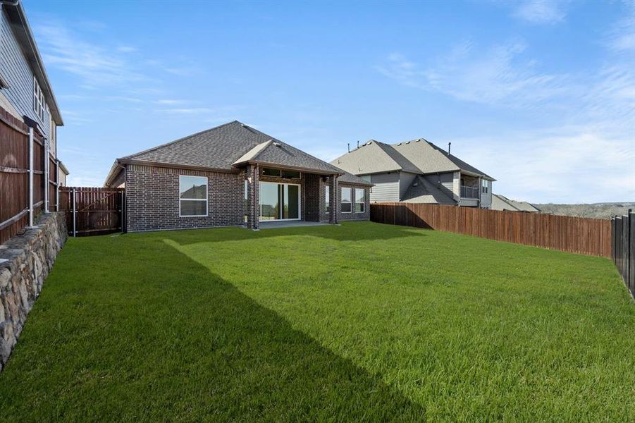 Exterior details and patio area of a home in High Country, Burleson (Image 21).