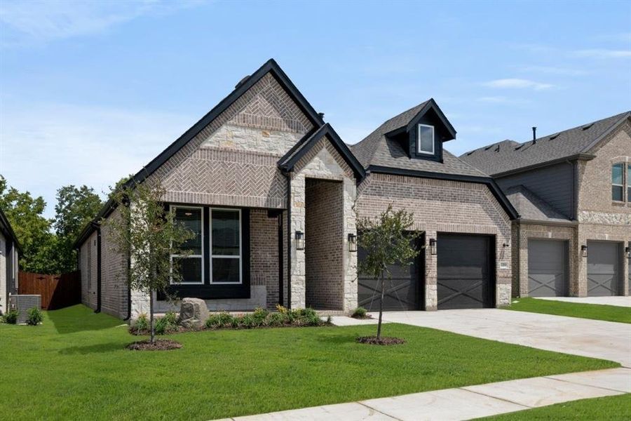 Front exterior of a new home in Birdsong, Mansfield, TX, highlighting curb appeal (Image 23). Front exterior of a new home in Birdsong, Mansfield, TX, highlighting curb appeal (Image 23).