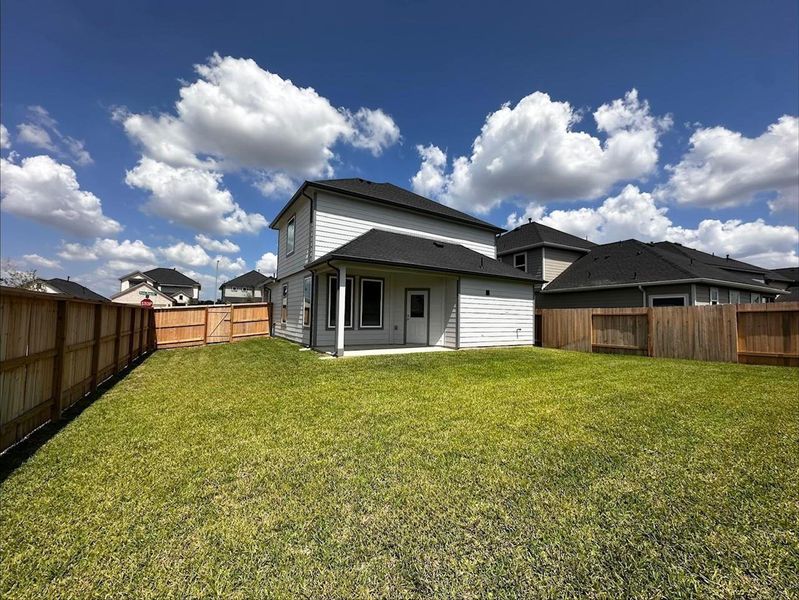 Front exterior of a new home in Grand Oaks Village, Houston, TX, highlighting curb appeal (Image 16). Front exterior of a new home in Grand Oaks Village, Houston, TX, highlighting curb appeal (Image 16).