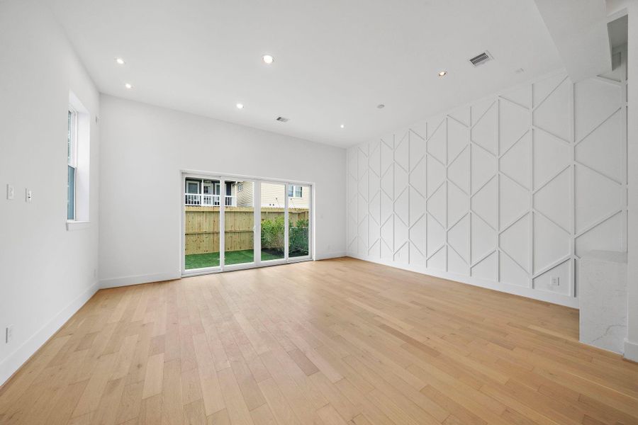 Spacious living/dining room with stylish accent wall. (Photos are of a previously completed home. Finishes are subject to change.) Spacious living/dining room with stylish accent wall. (Photos are of a previously completed home. Finishes are subject to change.)