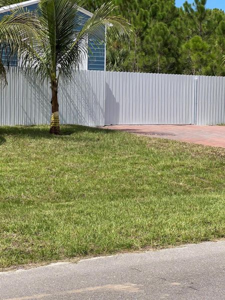 Front exterior of a new home in , Palm Bay, FL, highlighting curb appeal (Image 27).