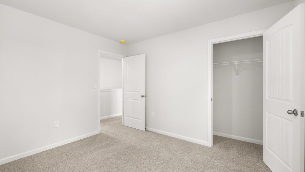 Representative unfurnished interior of a home built from the Hayden by D.R. Horton in Liberty Crossing, Braselton (Image 29).