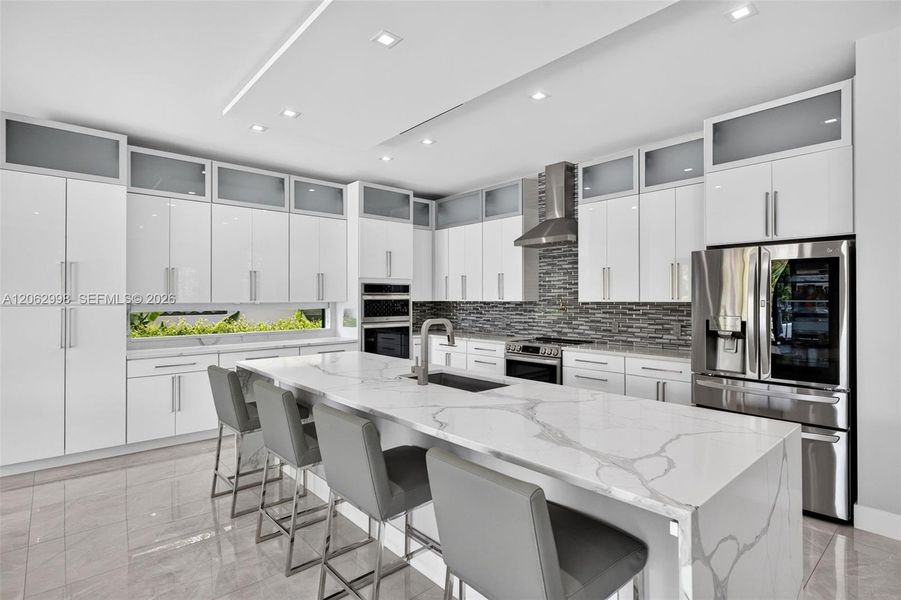 Chef's kitchen w/ counter seating, quartz waterfalls, 2 ovens, pot filler, tons of storage, KraftMaid cabinets