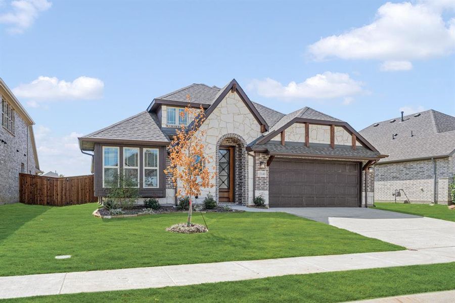 Front exterior of a new home in Woodstone, Providence Village, TX, highlighting curb appeal (Image 22). Front exterior of a new home in Woodstone, Providence Village, TX, highlighting curb appeal (Image 22).