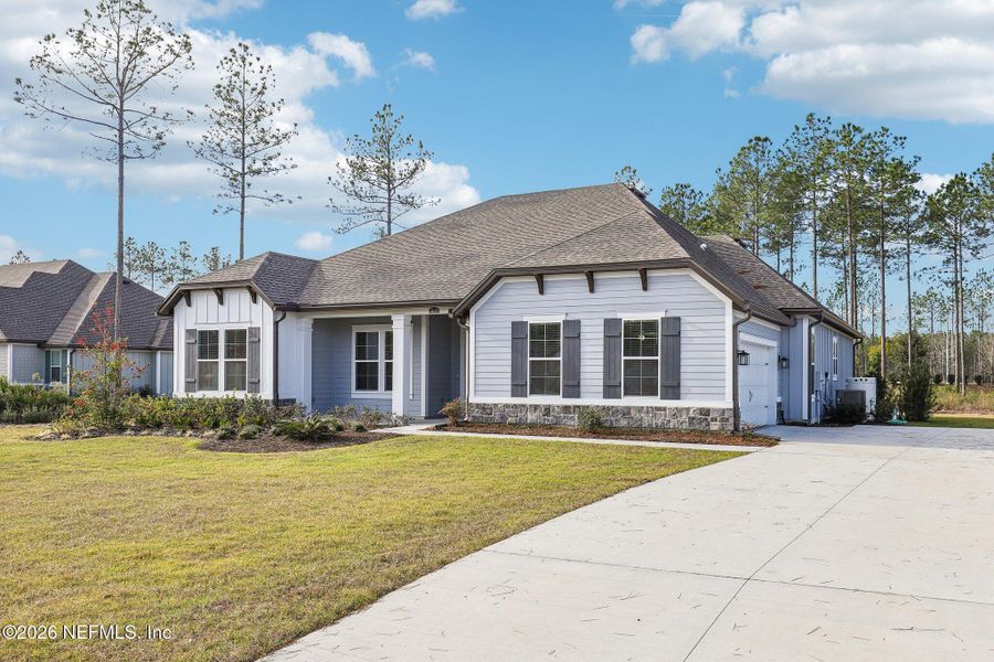 Front exterior of a new home in , Hilliard, FL, highlighting curb appeal (Image 26). Front exterior of a new home in , Hilliard, FL, highlighting curb appeal (Image 26).
