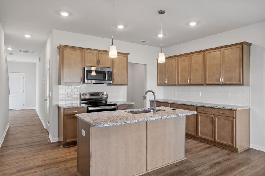 Furnished interior view inside a new home in West Main Townhomes, Sanford (Image 6).