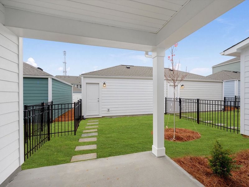 Exterior details and patio area of a home in North Creek Village - Townhomes, Huntersville (Image 3).