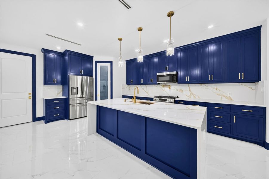 Expansive kitchen island provides generous workspace for everyday living and entertaining