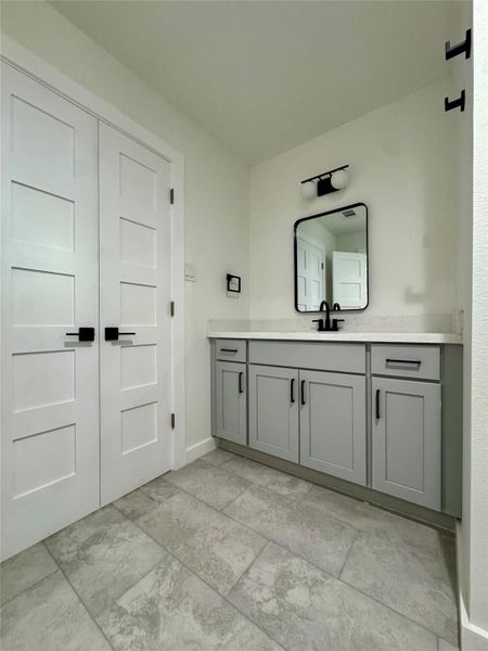 1st vanity and sink with storage in the primary, ensuite bathroom. 1st vanity and sink with storage in the primary, ensuite bathroom.