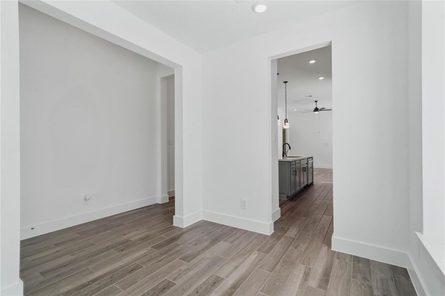 The dining room transitions seamlessly into both the kitchen and main hallway, ensuring an effortless and natural flow of traffic. The dining room transitions seamlessly into both the kitchen and main hallway, ensuring an effortless and natural flow of traffic.