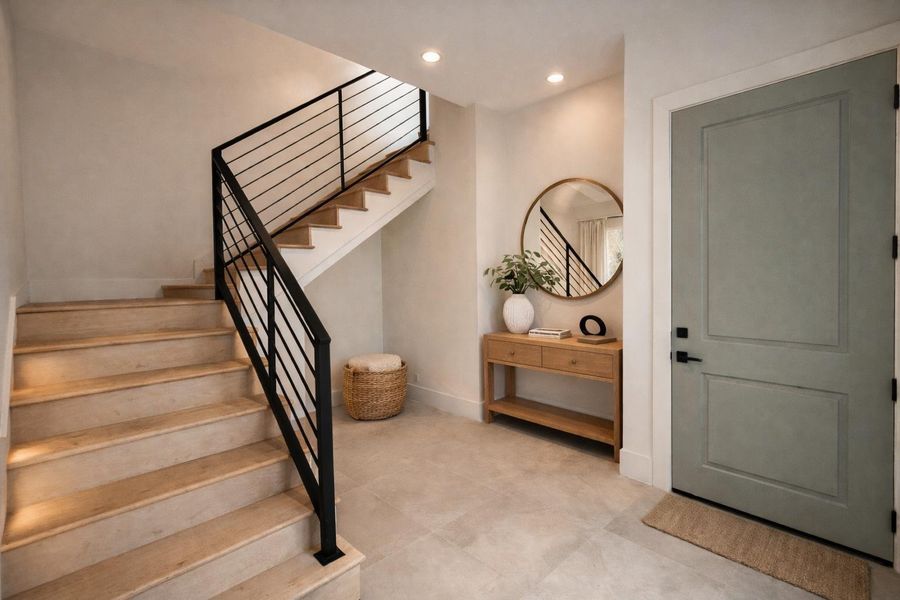 Spacious entry with high ceilings and plenty of room for a functional mud area, ideal for everyday organization and a welcoming first impression.